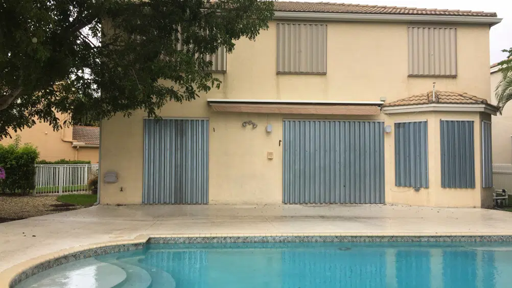 Rundown home, backyard with pool